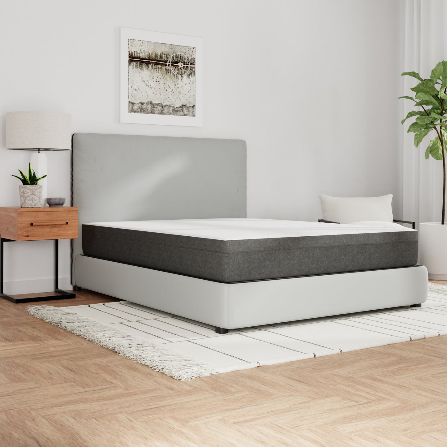 Modern bedroom with a bed / mattress, nightstand, lamp, and plant. Queen size mattress, top white and sides gray. medium firmness