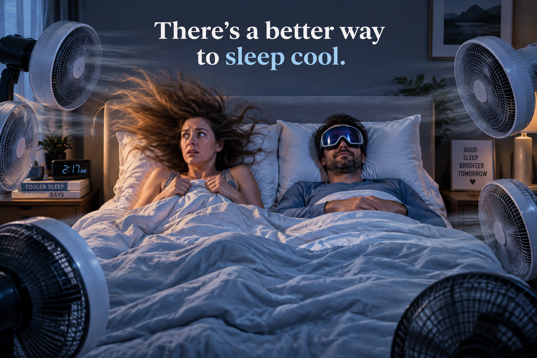 Couple in bed surrounded by fans, illustrating cooling sleep solutions for a Labor Day mattress buying guide.