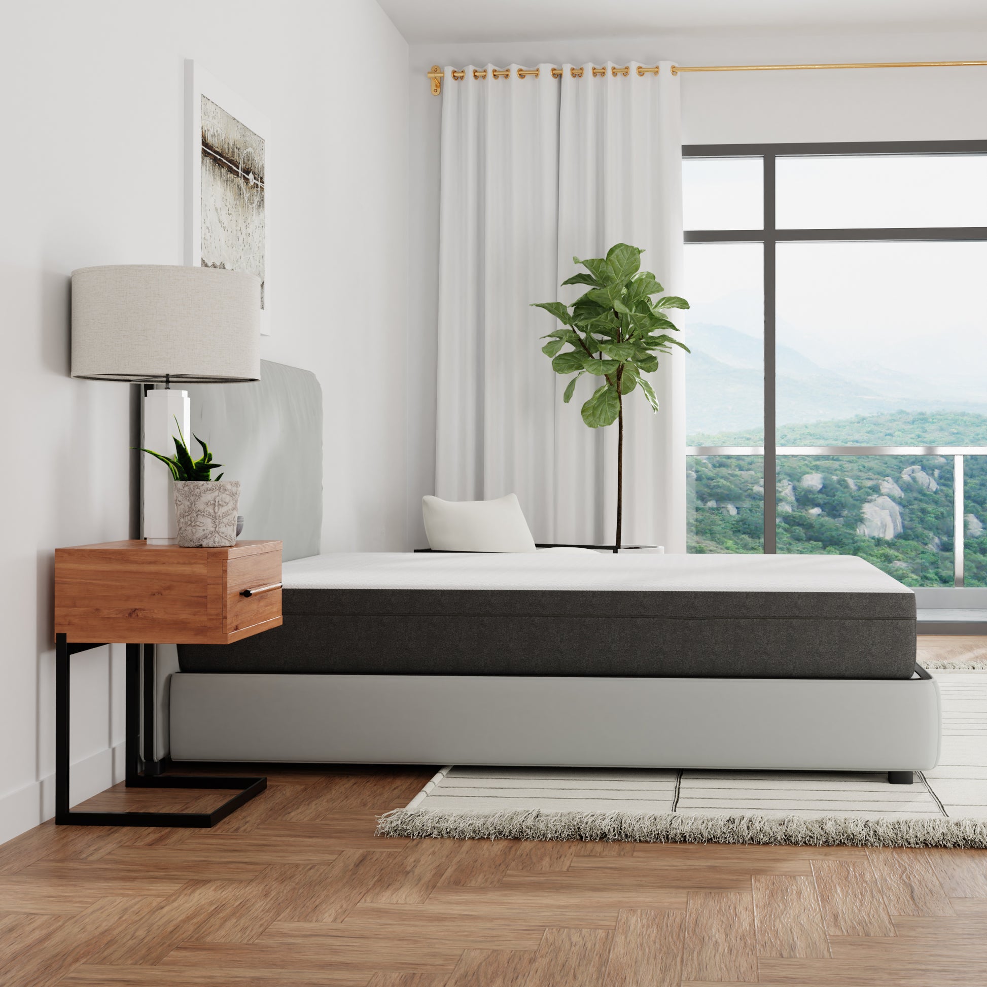 Modern bedroom with a bed / mattress, nightstand, lamp, and plant. Queen size mattress, top white and sides gray. Medium firmness