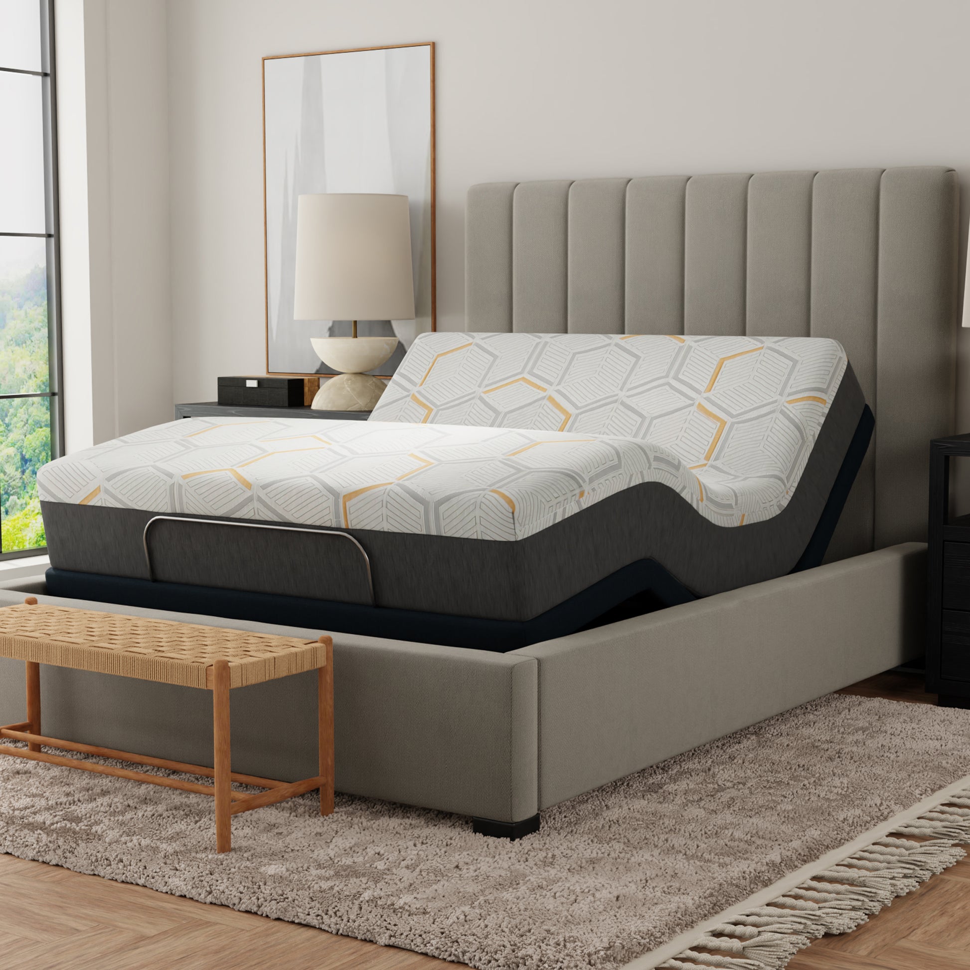 Gray upholstered bed with geometric-patterned mattress in a bedroom setting. 12 inch queen size copper mattress