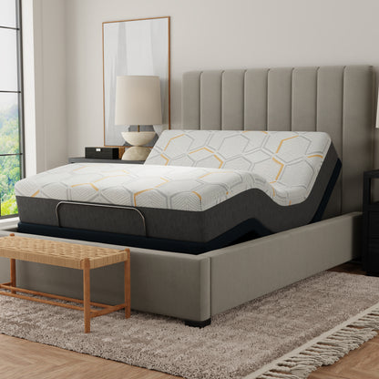 Gray upholstered bed with geometric-patterned mattress in a bedroom setting. 12 inch queen size copper mattress