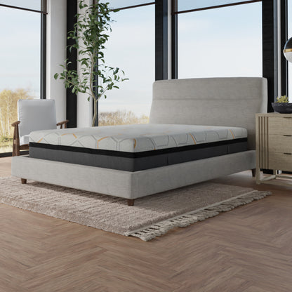 Bed with a mattress on a wooden floor in a room with large windows. 14 inch copper fabric mattress. queen size