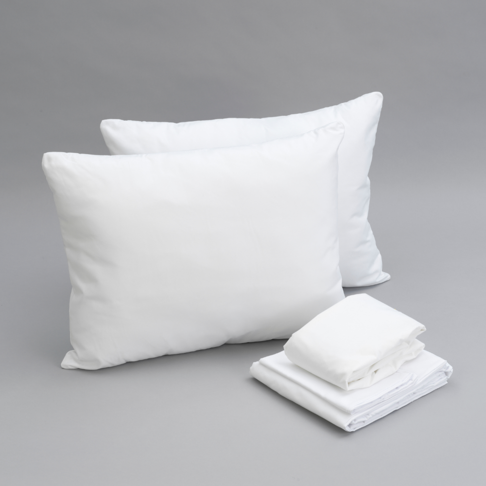 White pillows and folded sheets showing a bundle of 2 pillows, 1 mattress protector, and 1 sheet set are all together.