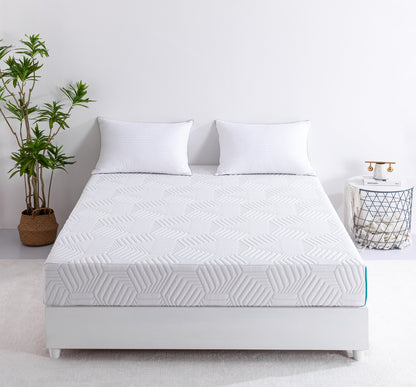 White 8-inch foam mattress with white cover on a bed with a plant and a side table in the background