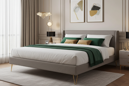Upholstered bed with white and green bedding, bed with brass legs. Bedroom setting