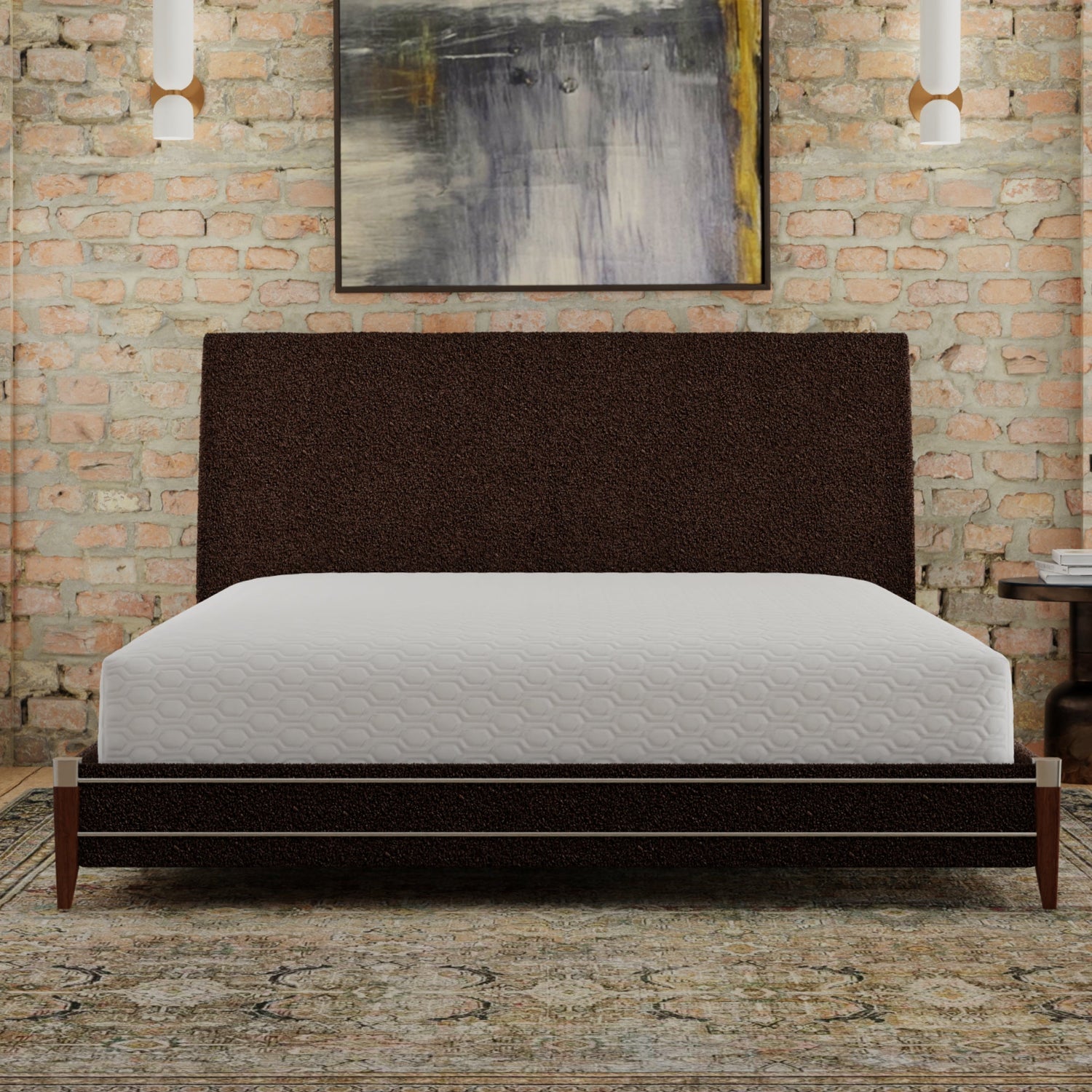 Dark brown upholstered bed with white mattress against a brick wall with abstract art. The mattress is covered with the ICE mattress protector. queen size