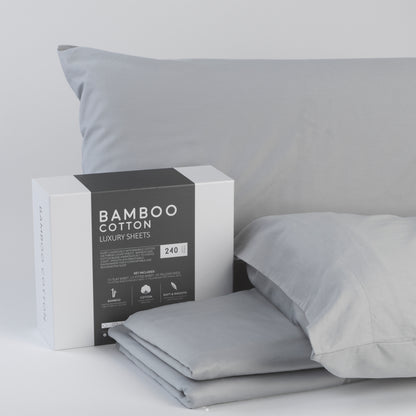 Gray bamboo cotton luxury sheets with packaging on a light gray background