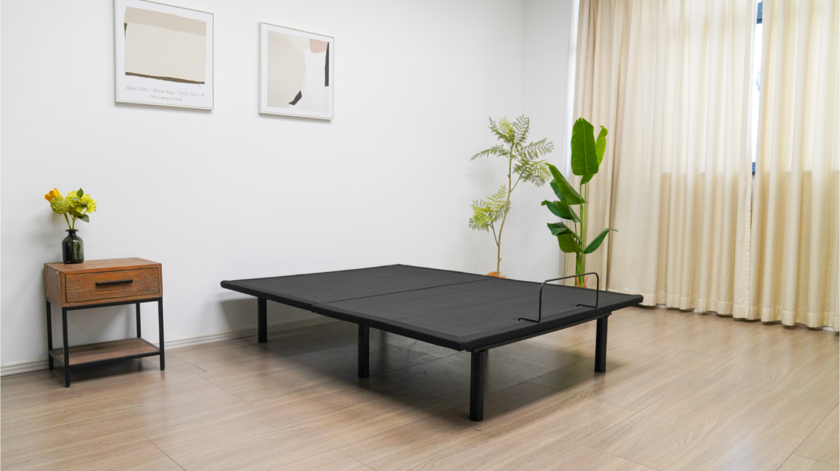 Rio 1.0 Essential Adjustable bed base in empty room. Adjustable bed lays flat
