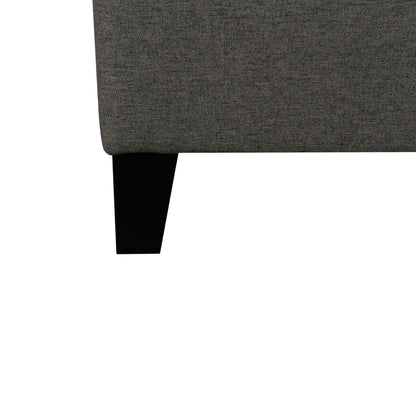 Gray upholstered corner of the Rowan platform bed- black legs on a white background