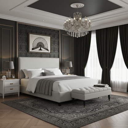 Upholstered bed and headboard with nailheads in a luxury bedroom space. King size bed / mattress