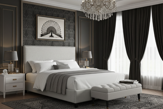 Luxurious bedroom with a large King size bed / mattress, chandelier, and decorative elements. Headboard has nailheads. white sheets and soft pillows