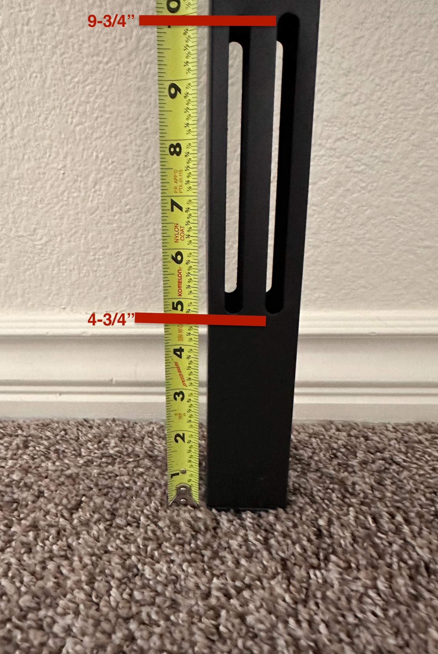 Real photo showing reinforced steel legs, powder-coat finish, two built-in slots accommodate a headboard. Slots measure 4-3/4" to 9-3/4" from the floor.