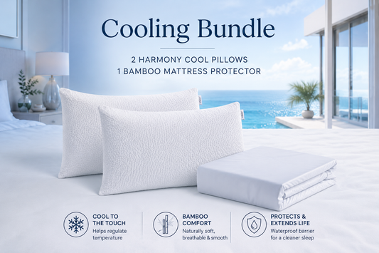 Owen Holmes Cooling Bundle featuring two Harmony Cool Pillows and a bamboo mattress protector in a luxury coastal bedroom designed for cooler, more comfortable sleep.