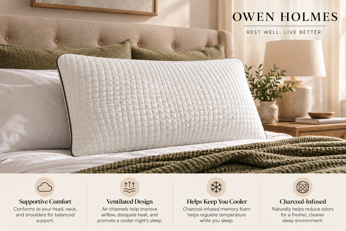Owen Holmes Charcoal memory foam pillow displayed on a luxurious bed with neutral bedding and warm bedside lighting