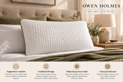 Owen Holmes Charcoal memory foam pillow displayed on a luxurious bed with neutral bedding and warm bedside lighting