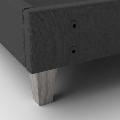 Dark gray upholstered platform bed with wooden and headboard drill holes shown to accept any headboard